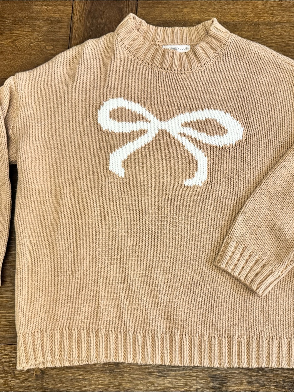 Sincerly Jules Beige Crewneck Sweater with White Bow Intarsia
